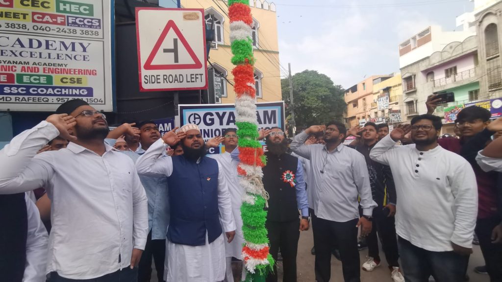 Students of Gyanam Junior College celebrating Independence Day with flag hoisting ceremony.