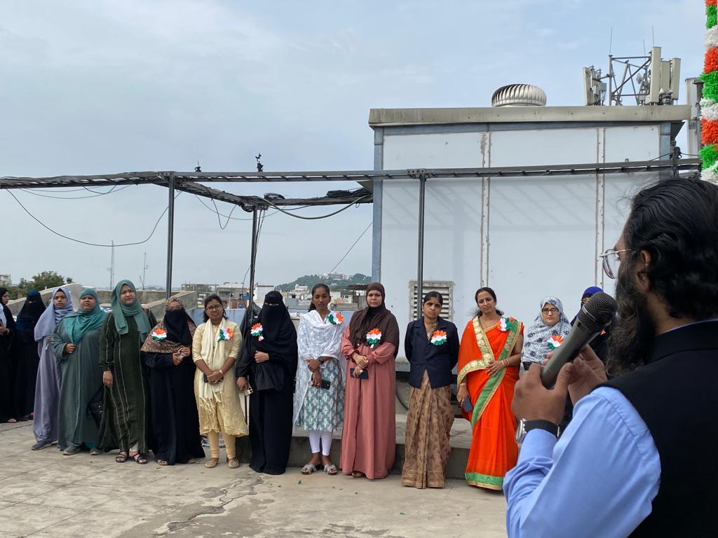 Students of Gyanam Junior College celebrating Independence Day with flag hoisting ceremony.