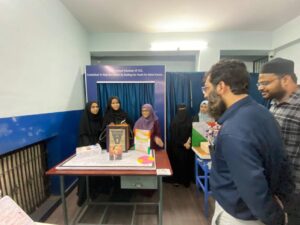Flag hoisting ceremony at Gyanam Junior College on Independence Day with students performing cultural programs in the background.